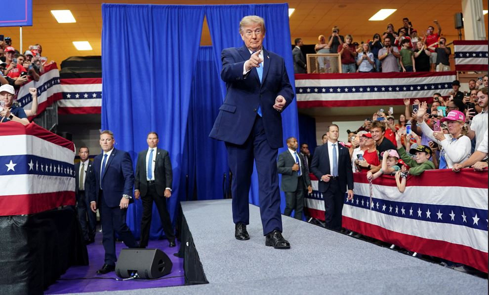 US President Donald Trump gestures as he walks during a rally at Butler High School in Vandalia, Ohio
